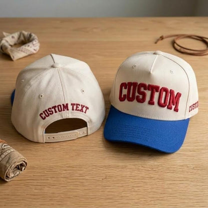 Custom cream baseball cap with royal blue brim and bold front lettering
