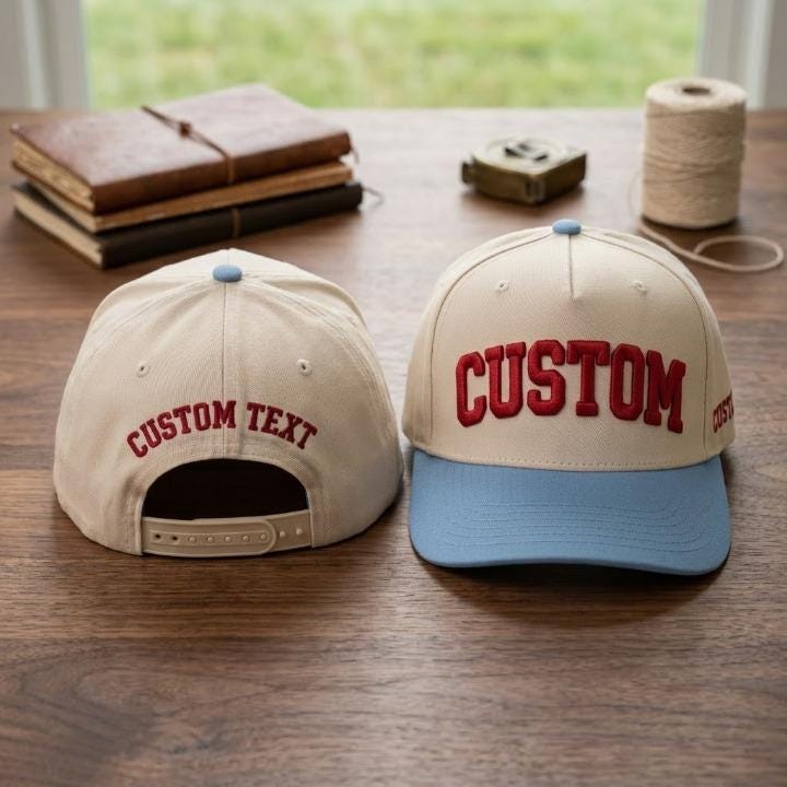 Cream personalized baseball cap with blue contrast brim and adjustable back closure