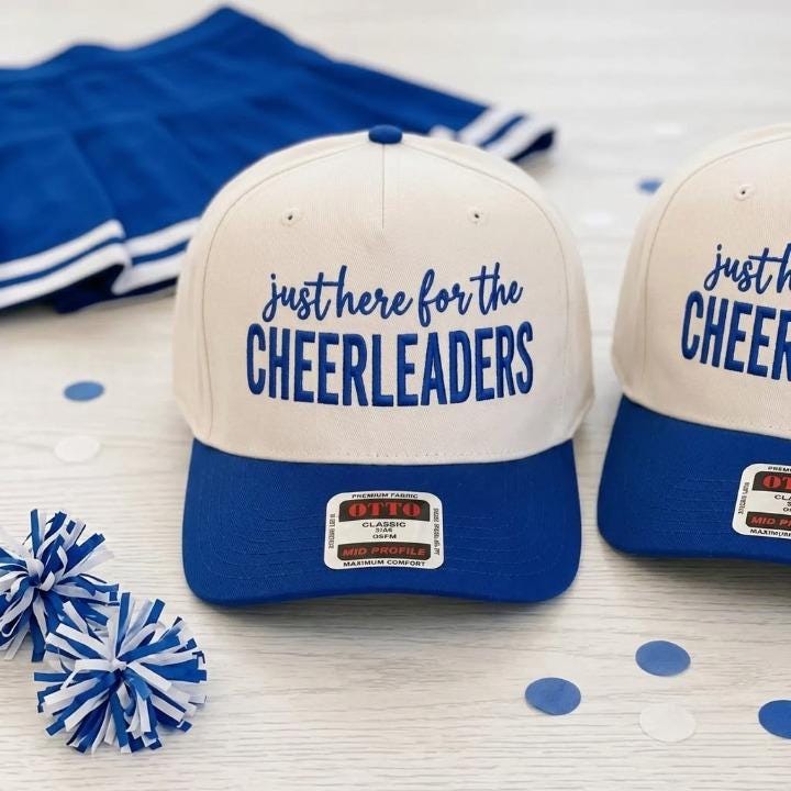 Cream and blue cheerleader hat with Just Here for the Cheerleaders lettering