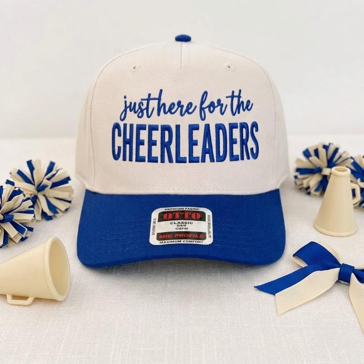 Cream and royal blue cheerleader hat shown with spirit accessories