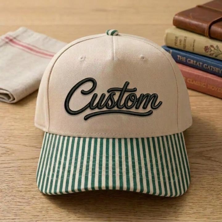 Khaki hat with black Custom script and green striped brim
