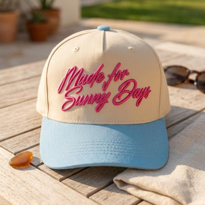 Cream summer hat with blue brim and pink script embroidery