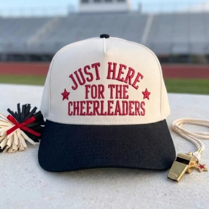 Two-tone cheerleader hat with black brim and star accents