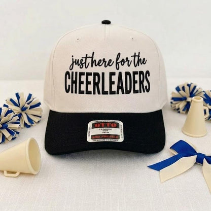 Cream and black cheerleader hat with bold front lettering