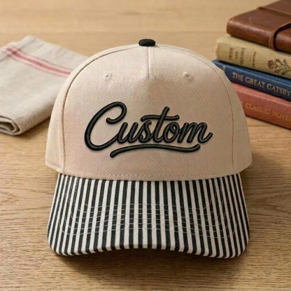 Khaki hat with black Custom script and black striped brim