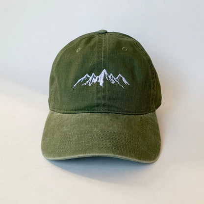 Olive green washed dad hat with minimalist white embroidered mountain range – ideal for hikers and nature lovers