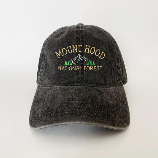Washed black dad hat with embroidered Mount Hood mountain and pine trees – perfect for national forest lovers and hikers