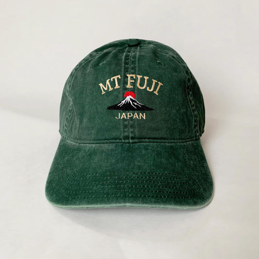 Green washed dad hat with embroidered Mt. Fuji and red sun design