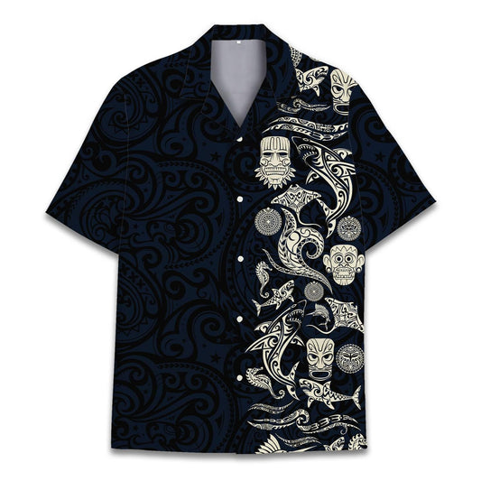 Hawaiian shirt with black background and ivory Polynesian tribal art including tiki masks and dolphins – island-inspired design.