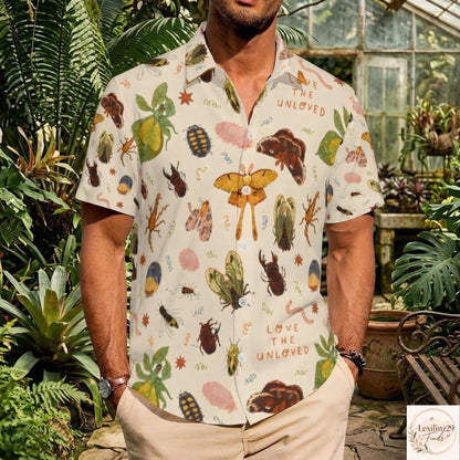 Insect-themed men's Hawaiian shirt with colorful insect and botanical print, displayed in a greenhouse setting