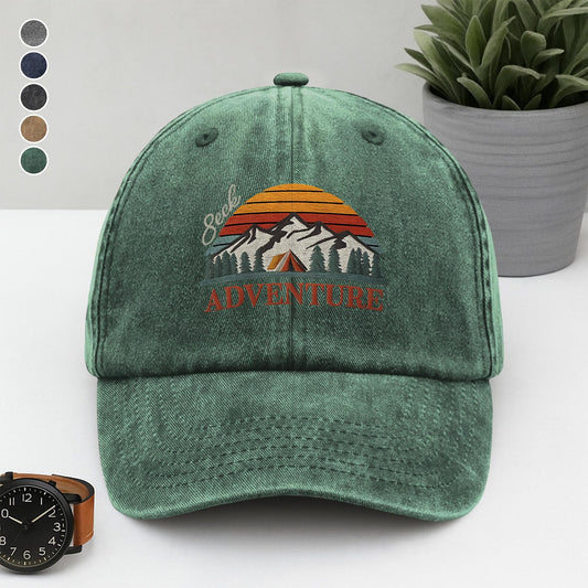 Washed green dad cap embroidered with mountains, tent, sunset, and the quote “Seek Adventure” – perfect for outdoor lovers