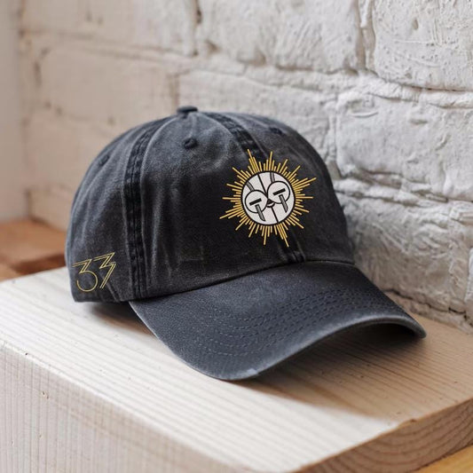 Black washed dad hat with “Terrasen” embroidered in beige and a golden stag crest