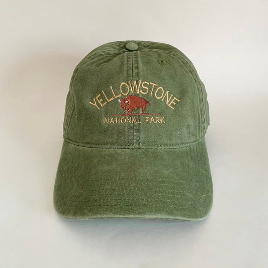 Olive green embroidered dad hat with Yellowstone National Park and bison design